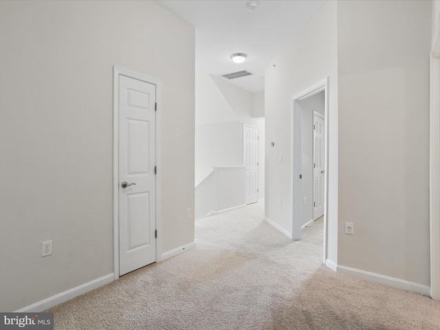 hallway with light carpet