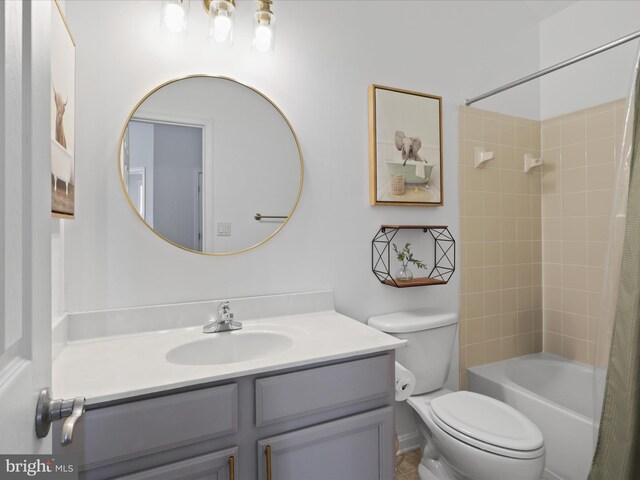 full bathroom featuring vanity, toilet, and shower / bath combo with shower curtain