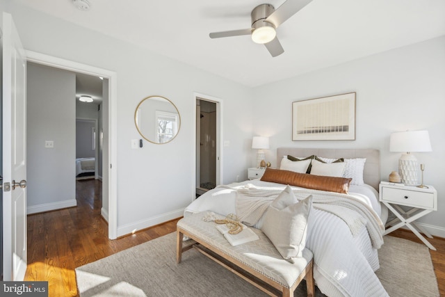 bedroom with wood finished floors, baseboards, and ceiling fan