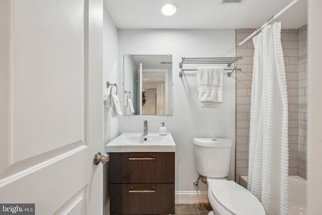 full bathroom featuring visible vents, toilet, vanity, and shower / bath combination with curtain