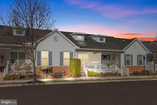 cape cod home with covered porch