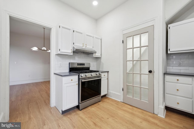 kitchen featuring white cabinets, light wood-type flooring, and stainless steel gas stove