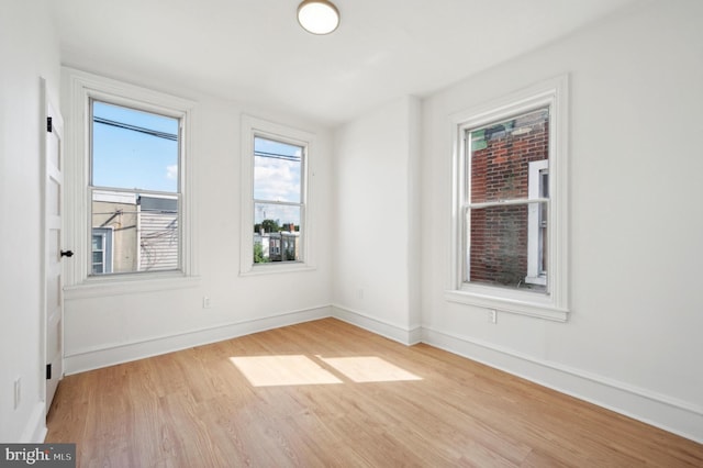 unfurnished room featuring light hardwood / wood-style floors