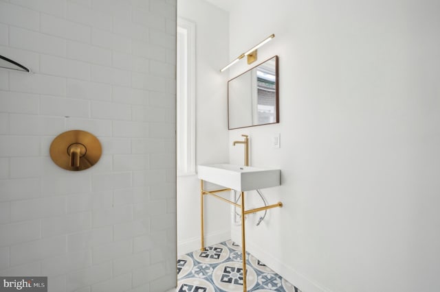 bathroom with tile patterned floors and sink