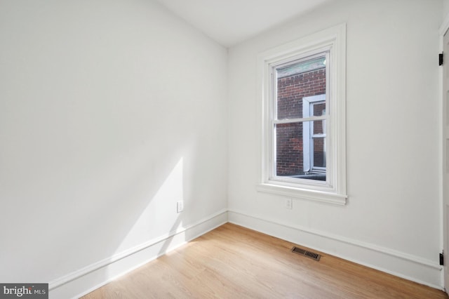 spare room with light hardwood / wood-style floors