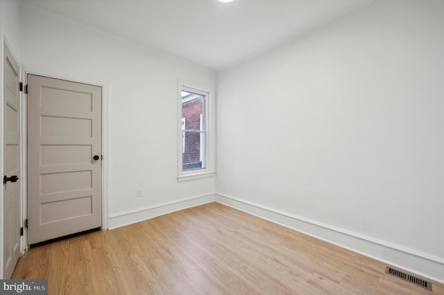 unfurnished room featuring light wood-type flooring