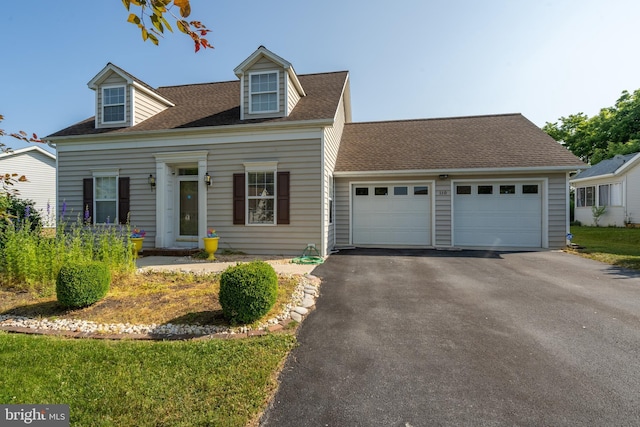 cape cod house with a garage