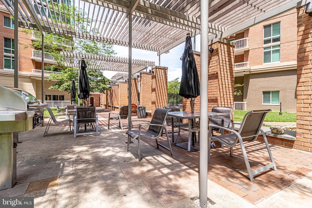 view of patio / terrace with a pergola and grilling area