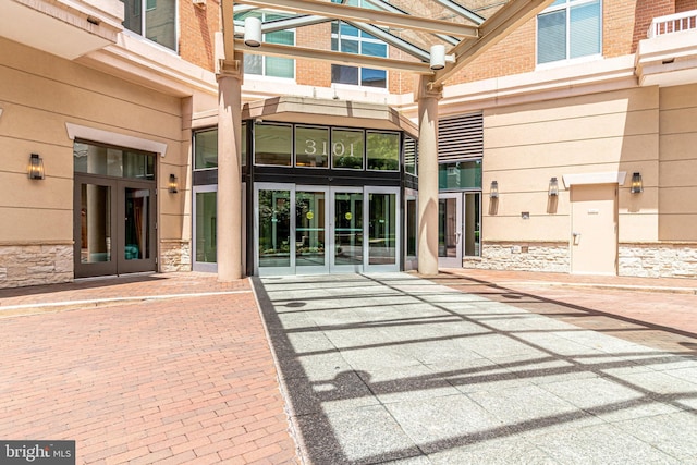 view of exterior entry featuring french doors