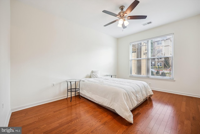 bedroom with hardwood / wood-style flooring and ceiling fan