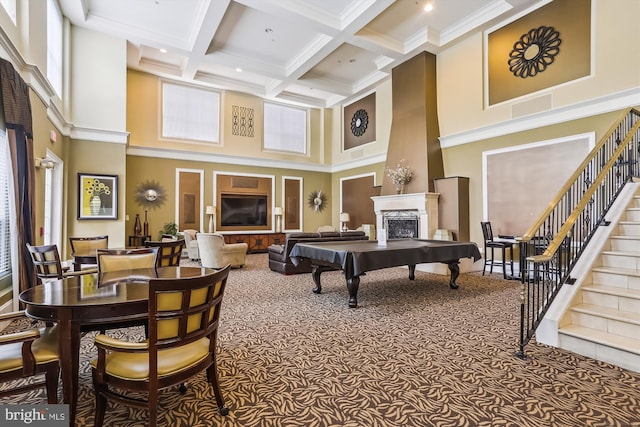 game room featuring carpet, a high ceiling, coffered ceiling, ornamental molding, and beamed ceiling