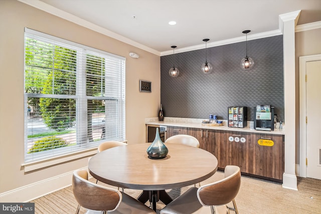 dining area with crown molding