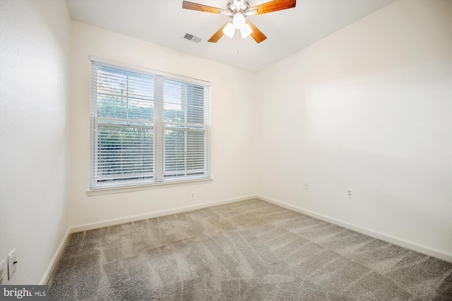 carpeted empty room with ceiling fan and vaulted ceiling