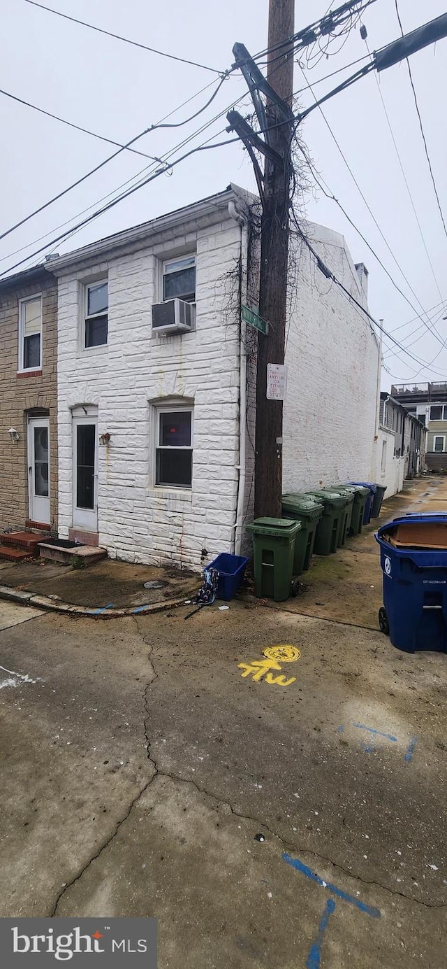 view of front of property featuring cooling unit