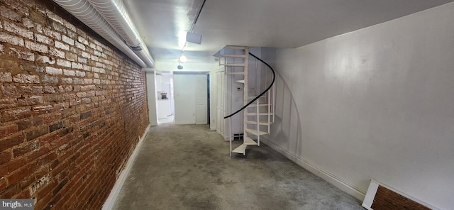 basement with brick wall