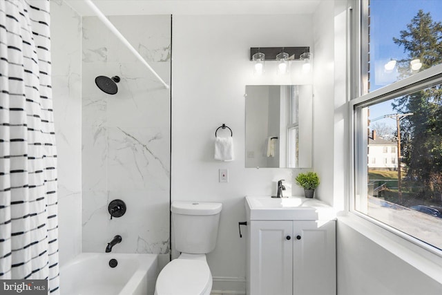 full bathroom featuring plenty of natural light, toilet, shower / bath combo, and vanity