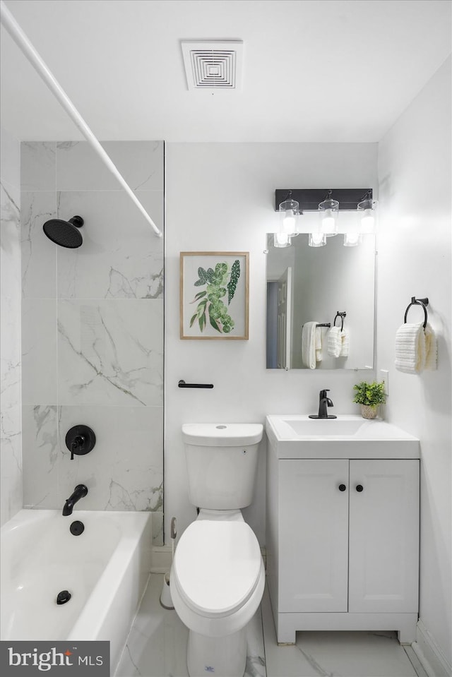 full bathroom featuring vanity, toilet, and tiled shower / bath