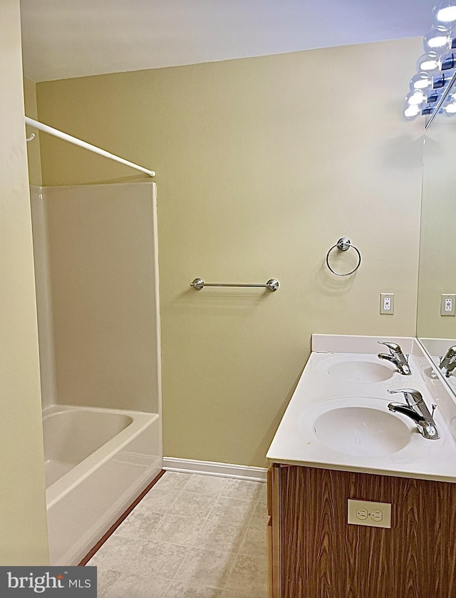 bathroom with vanity and  shower combination