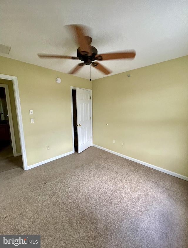 unfurnished bedroom featuring carpet flooring and ceiling fan