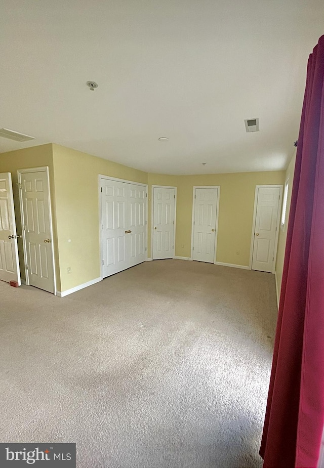 spare room featuring carpet flooring