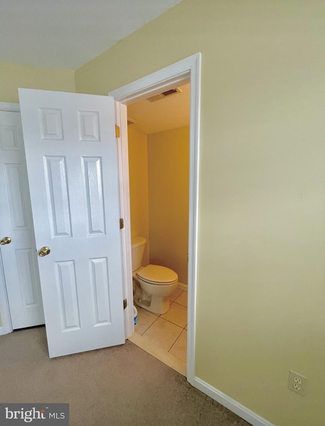 bathroom featuring tile patterned floors and toilet