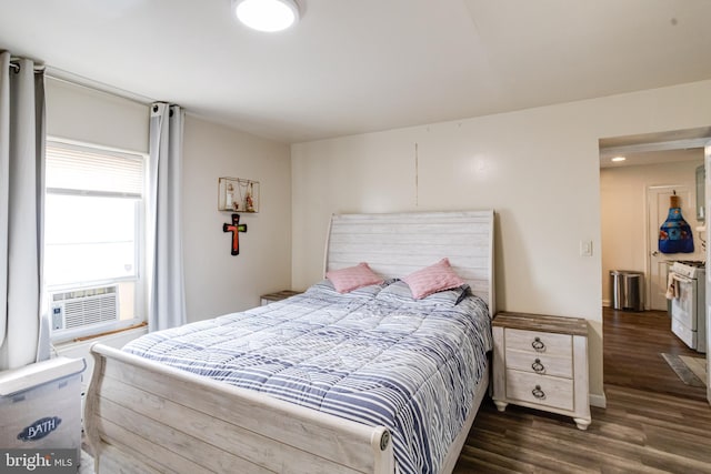 bedroom featuring cooling unit and dark hardwood / wood-style flooring