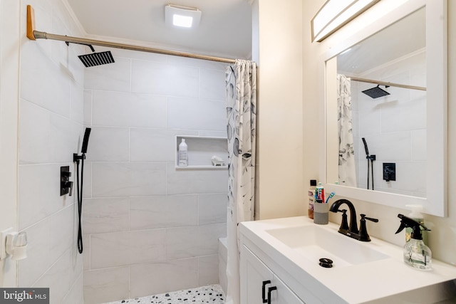 bathroom featuring curtained shower and vanity