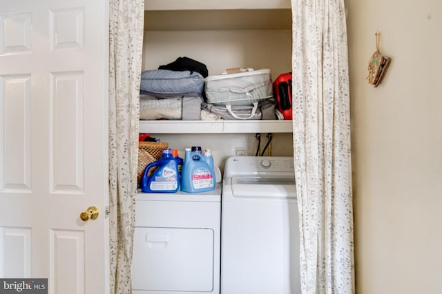 laundry room featuring washing machine and dryer