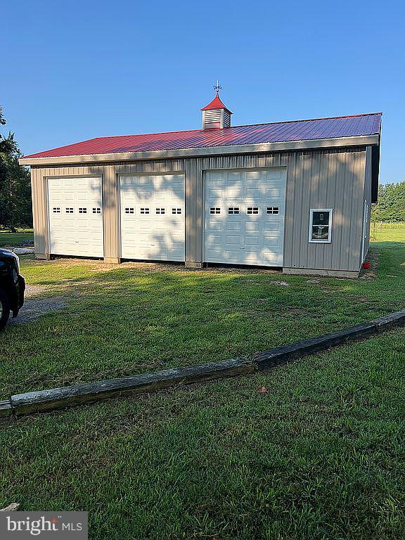 garage with a lawn