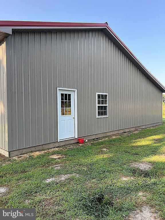 view of side of home featuring a yard