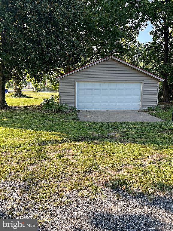 garage with a lawn