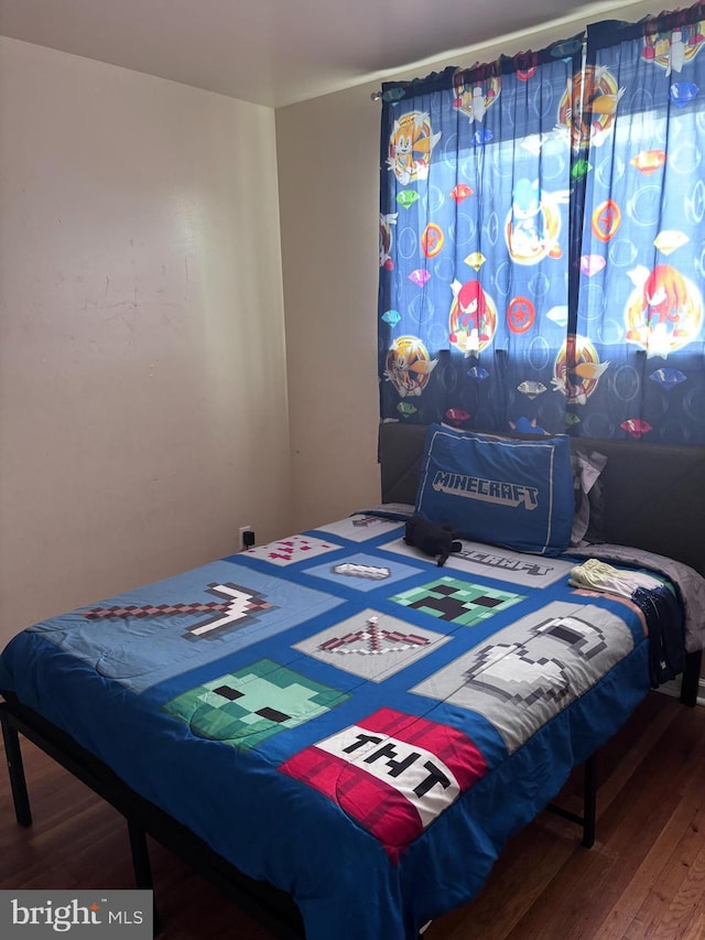 bedroom with wood-type flooring