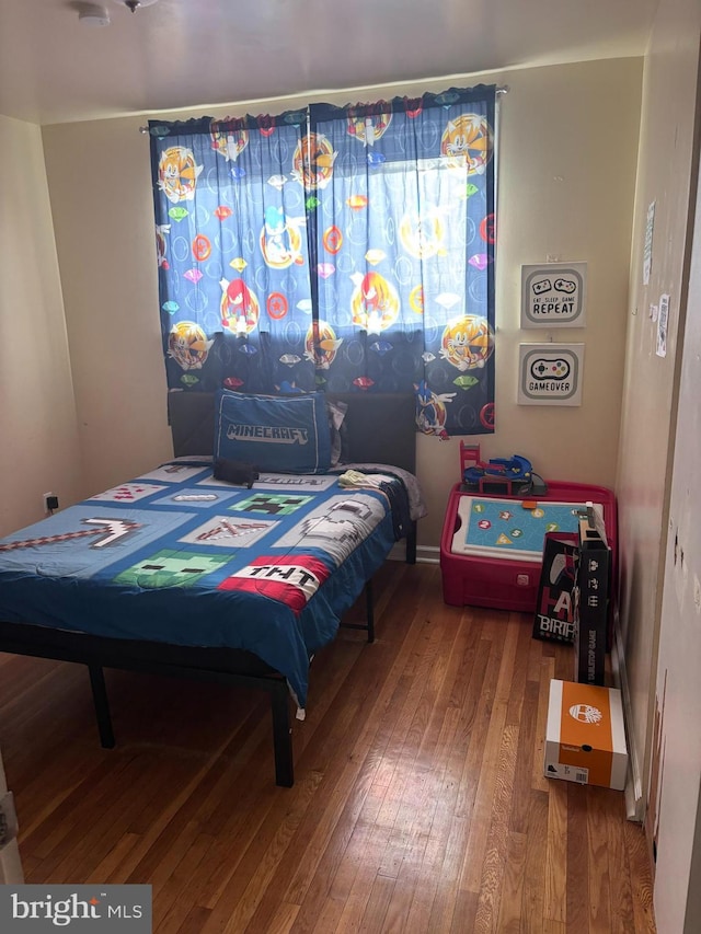 bedroom featuring wood-type flooring