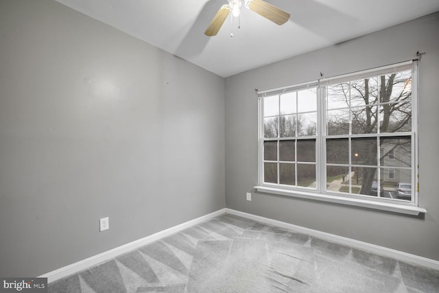 unfurnished room featuring carpet and ceiling fan