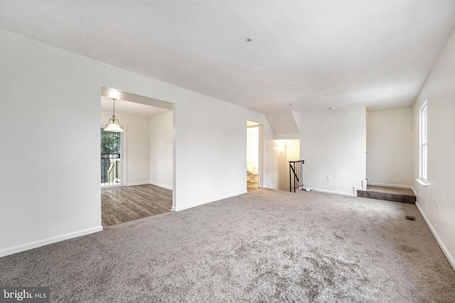 unfurnished room featuring carpet