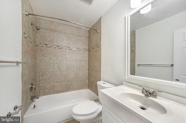 full bathroom featuring vanity, toilet, and tiled shower / bath