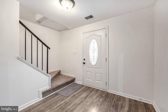 foyer entrance with hardwood / wood-style floors