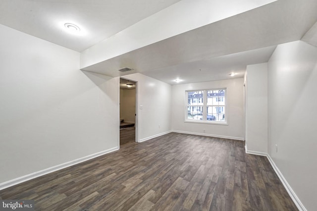 basement featuring dark hardwood / wood-style floors