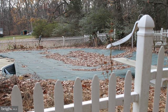 view of pool with a water slide