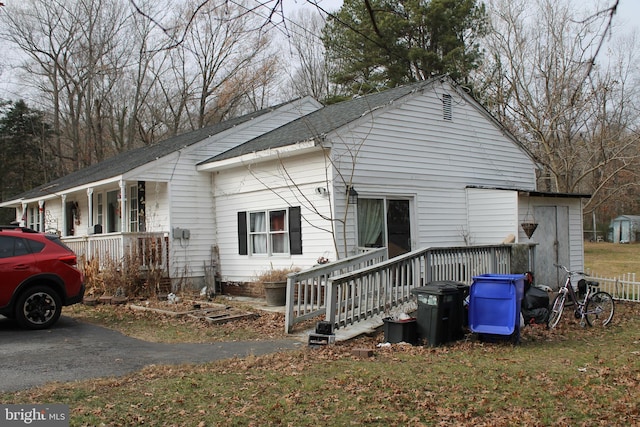 view of property exterior with covered porch