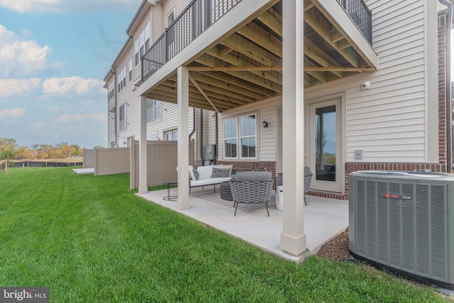 view of patio / terrace with an outdoor living space and central air condition unit