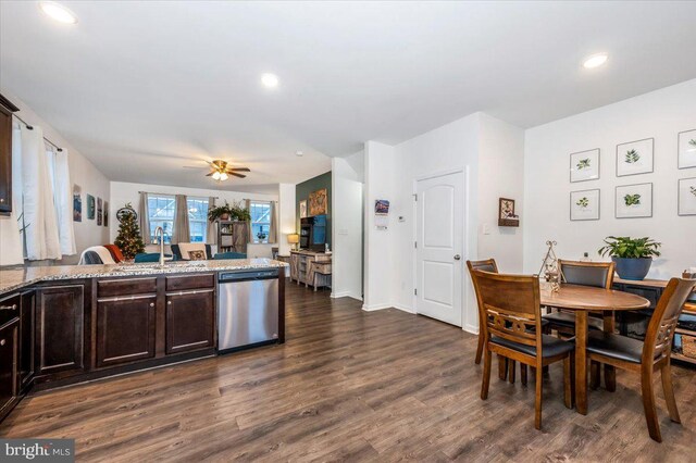 kitchen featuring stainless steel dishwasher, dark brown cabinets, ceiling fan, dark wood-type flooring, and sink