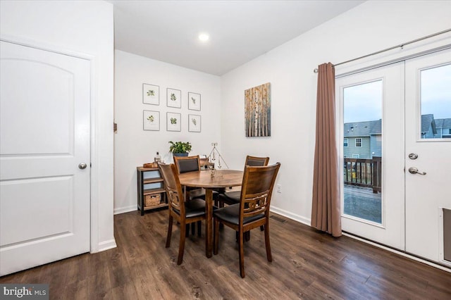 dining room featuring dark hardwood / wood-style flooring and french doors