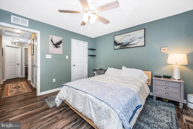 bedroom with ceiling fan and dark hardwood / wood-style flooring