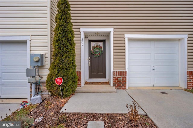 doorway to property featuring a garage