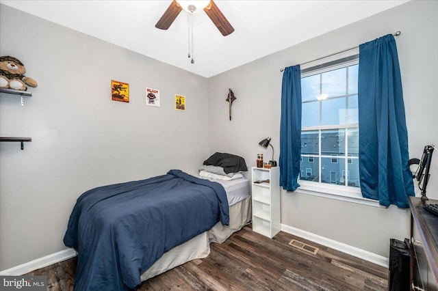 bedroom featuring ceiling fan and dark hardwood / wood-style floors