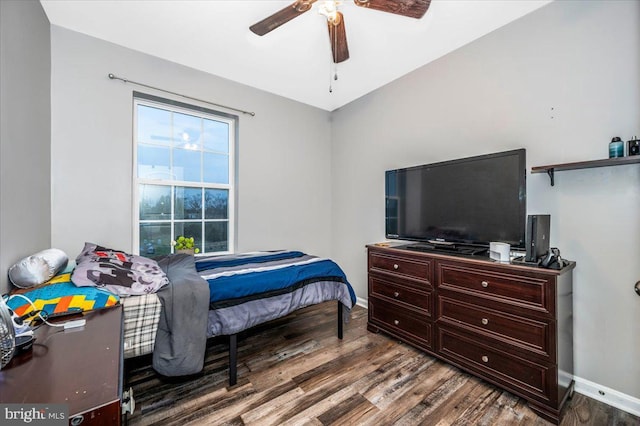 bedroom with ceiling fan and hardwood / wood-style flooring