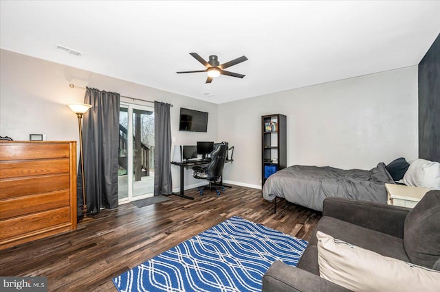 bedroom featuring ceiling fan, dark hardwood / wood-style floors, and access to outside