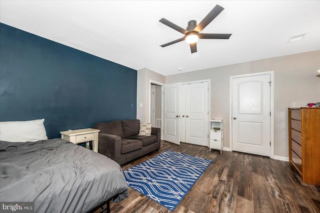 bedroom with ceiling fan and dark wood-type flooring