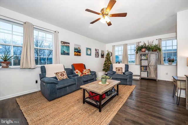 living room featuring ceiling fan, dark hardwood / wood-style flooring, and a wealth of natural light